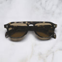 An image of the GR14 Aviator Sunglasses in Grey Havana frame frontal view with arms closed marble background