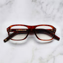 An image of the 0847 Kingsman Aviator Opticals (Small) in Red Havana frame frontal view with arms closed marble background