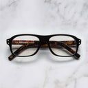 An image of the 0847 Kingsman Aviator Opticals in Black on Vintage Havana frame frontal view with arms closed marble background