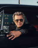 A Campaign image of Billy Idol: wearing the Limited-Edition Triumph Sunglass in Gold/Black.