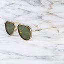 An image of the Cutler and Gross The Great Frog Limited-Edition Triumph Aviator Sunglasses in Gold/Havana frame side view with arms open marble background.
