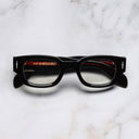 An image of the The Great Frog Soaring Eagle Square Optical Glasses in Black frame frontal view with arms closed marble background