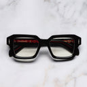 An image of the The Great Frog Bones Link Square Optical Glasses in Black frame frontal view with arms closed marble background