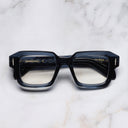 An image of the The Great Frog Bones Link Square Optical Glasses in Deep Blue frame frontal view with arms closed marble background
