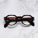 An image of the The Great Frog Lucky Diamond I Round Glasses in Black frame frontal view with arms closed marble background
