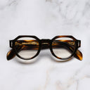 An image of the The Great Frog Lucky Diamond I Round Glasses in Havana frame frontal view with arms closed marble background