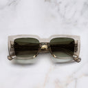 An image of the The Great Frog Mini Reaper Square Sunglasses in Sand Crystal frame frontal view with arms closed marble background