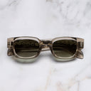 An image of the The Great Frog Soaring Eagle Rectangle Sunglasses in Sand Crystal frame frontal view with arms closed marble background