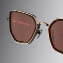 An image of the Cutler and Gross The Great Frog Paisley Cat Eye Sunglasses in Gun Metal/Bordeaux frame detail close up from right side view.