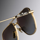 An image of the Cutler and Gross The Great Frog Paterson Aviator Sunglasses in Gold/Silver frame detail close up of right hinge and temple