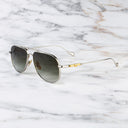 An image of the Cutler and Gross The Great Frog Paterson Aviator Sunglasses in Silver/Gold frame side view with arms open marble background.