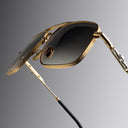 An image of the Cutler and Gross The Great Frog Ganton Navigator Sunglasses in Gold/Silver frame detail close up from right side view.