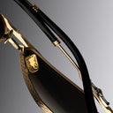 An image of the Cutler and Gross The Great Frog Ganton Navigator Sunglasses in Gold/Silver frame back view with arms closed.