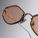 An image of the Cutler and Gross The Great Frog Carol Rectangular Sunglasses frame detail close up from right side view.