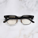 An image of the 0004 Kingsman Optical Round Glasses in Black frame frontal view with arms closed marble background