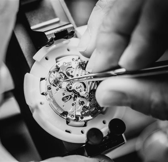 Black and white image of the craftsmanship on a watch.