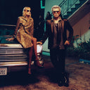An image of Staz Lindes wearing the Cutler and Gross The Great Frog Paisley Cat Eye Sunglasses in Gold/Olive frame.