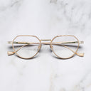 An image of the Pelham 1430 Round Opticals in Pink Gold/Silver frame frontal view with arms closed marble background