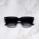 An image of the Breitling Cloudbreak 0004 Rectangle Sunglasses in Dark Grey frame frontal view with arms closed marble background 