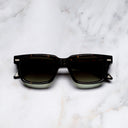An image of the Breitling Cloudbreak 0004 Rectangle Sunglasses in Havana frame frontal view with arms closed marble background 