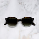 An image of the Breitling Biarritz 0003 Round Sunglasses in Classic Havana frame frontal view with arms closed marble background 
