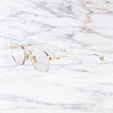 An image of the Lansdowne 1431 Square Opticals in Silver/Gold frame side view with arms open marble background