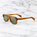 An image of the GR14 Aviator Sunglasses in Mustard Horn frame side view with arms open marble background