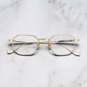 An image of the Lansdowne 1431 Square Opticals in Gold frame frontal view with arms closed marble background