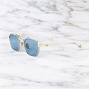 An image of the Cranley 1425 Aviator Sunglasses in Silver/Gold frame side view with arms open marble background