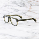 An image of the GR14 Aviator Opticals in Multi Olive frame side view with arms open marble background
