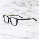 An image of the GR10 Square Opticals in Black frame side view with arms open marble background