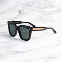An image of the Breitling Marisol 0005 Square Sunglasses in 18K Red Gold frame side view with arms open marble background