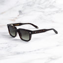 An image of the Breitling Cloudbreak 0004 Rectangle Sunglasses in Havana frame side view with arms open marble background