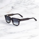 An image of the Breitling Cloudbreak 0004 Rectangle Sunglasses in Dark Grey frame side view with arms open marble background