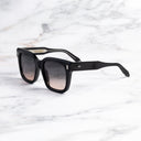 An image of the Breitling Marisol 0005 Square Sunglasses in Black frame side view with arms open marble background