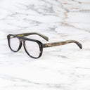 An image of the Cutler and Gross 0822V2 Aviator Horn Optical in Slate Grey Buffalo Horn frame side view with arms open marble background