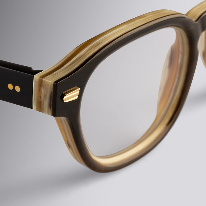 An image of the Cutler and Gross 9290 Round Horn Optical in Smoke Brown/Cream Buffalo Horn frame detail close up of left hinge and temple
