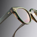 An image of the Cutler and Gross 9298 Round Horn Optical in Moss Green/Brown Buffalo Horn frame detail close up of left hinge and temple