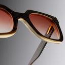 An image of the Cutler and Gross 4469 Square Horn Sunglass in Smoke Brown/Cream Buffalo Horn frame detail close up of right lens and temple