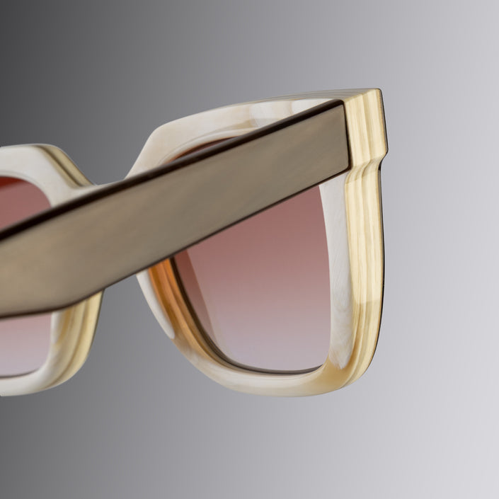 An image of the Cutler and Gross 4469 Square Horn Sunglass in Smoke Brown/Cream Buffalo Horn frame detail close up of right hinge and temple