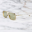 An image of the Knightsbridge 1971 Navigator Sunglasses frame side view with arms open marble background