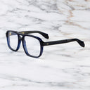 An image of the 1394 Aviator Optical in Classic Navy Blue frame side view with arms open marble background