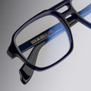 An image of the 1394 Aviator Optical in Classic Navy Blue frame detail close up from left side view