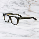An image of the 1410 Square Optical (Large) in Olive frame side view with arms open marble background