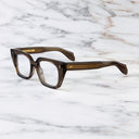 An image of the 1411 Cat Eye Optical in Brown Crystal frame frontal view with arms closed marble background
