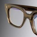 An image of the 1411 Cat Eye Optical in Brown Crystal frame detail close up of left lens and temple