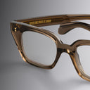 An image of the 1411 Cat Eye Optical in Brown Crystal frame detail close up of left lens and temple