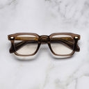 An image of the 1416 Square Optical in Brown Crystal frame frontal view with arms closed marble background
