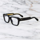 An image of the 1432 Square Optical in Black frame side view with arms open marble background