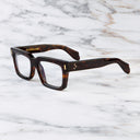 An image of the 9386 Square Optical in Dark Turtle frame side view with arms open marble background